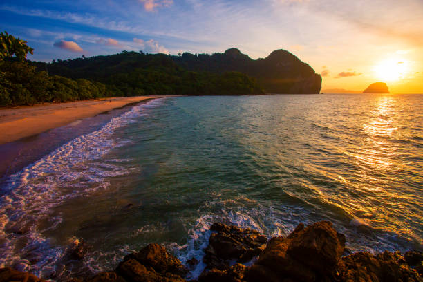 istock Amazing Sunset at the beach, with sea waves 1156640488
