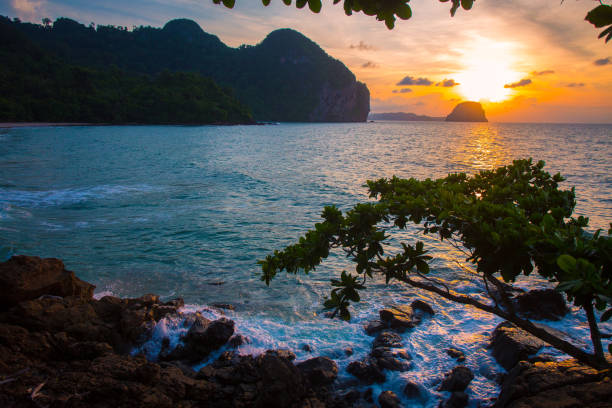 istock Amazing Sunset at the beach, with sea waves 1156640529