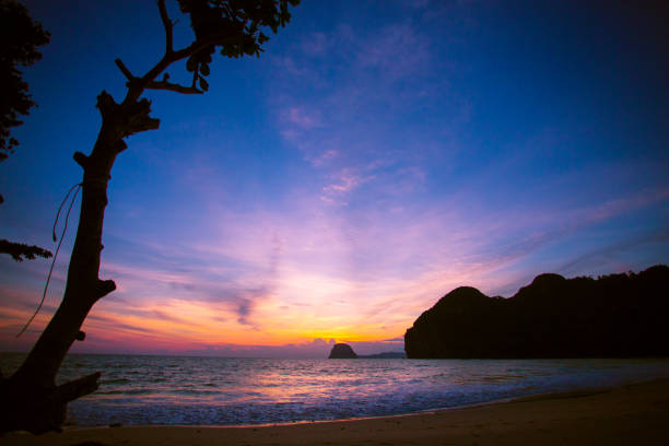 istock Amazing Sunset at the beach, with sea waves 1156640631