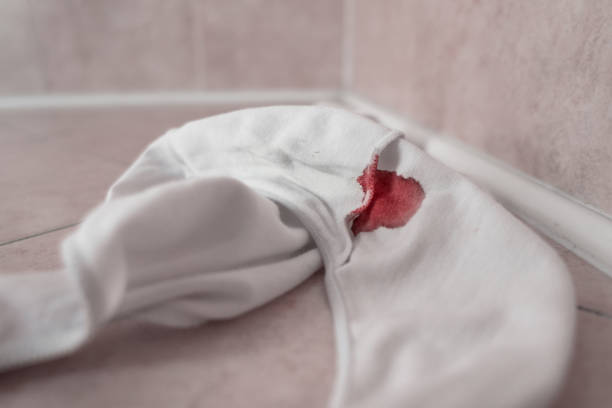 Panties in bloody stain Panties in bloody stain. Beginning of the menstrual cycle. Signal of the transition from girl to woman. Selective focus. period stains stock pictures, royalty-free photos & images