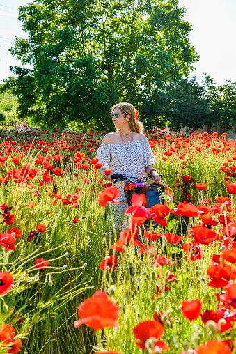 Woman in poppies.