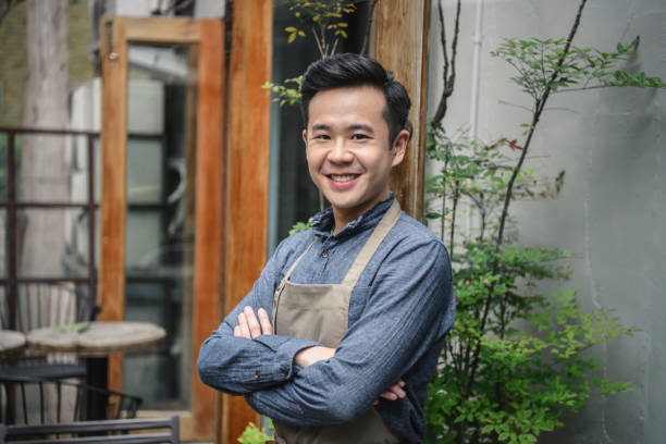 istock Young business owner portrait outside cafe 1156641892