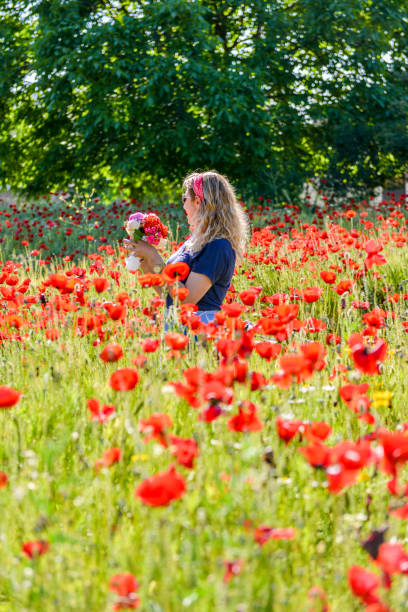 istock Woman in poppies. 1156643064