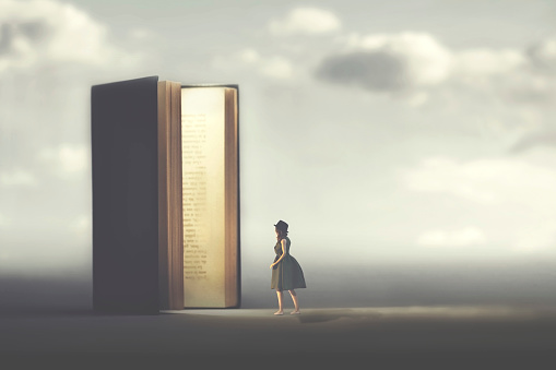 surreal book opens a door illuminated to a woman, concept of way to freedom