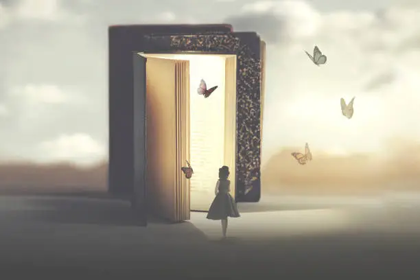 Photo of poetic encounter between a woman and butterflies coming out of a book