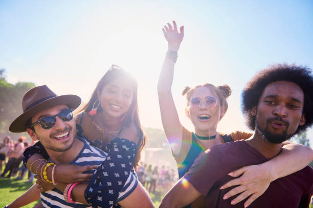 istock Two playful couples having great fun at music festival 1156644786