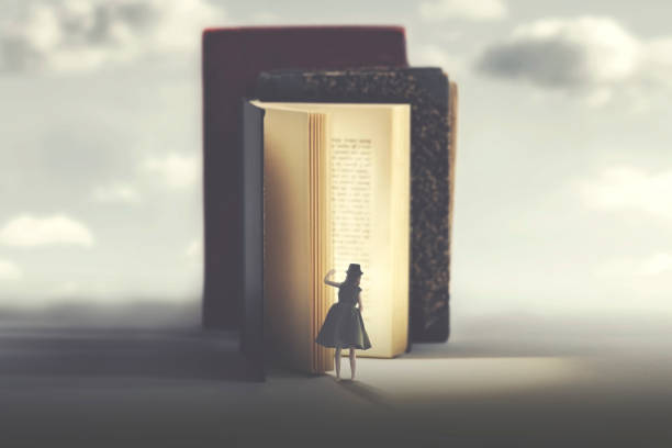 istock curious woman looks into a mysterious illuminated book 1156644939