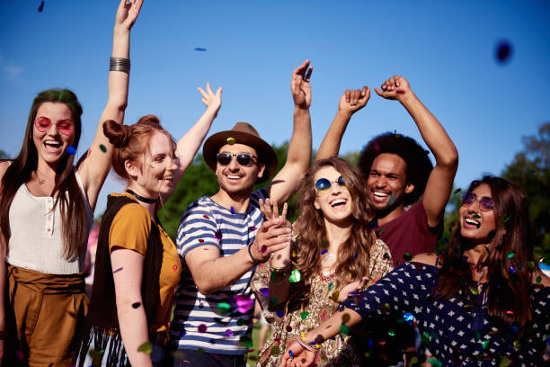 istock Happy friends dancing in confetti 1156649447