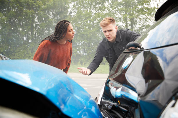 istock Two Angry Motorists Arguing Over Responsibility For Car Accident 1156652288