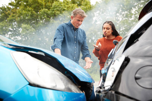 istock Two Angry Motorists Arguing Over Responsibility For Car Accident 1156652773