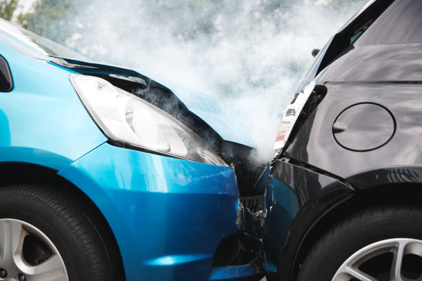 Close Up Of Two Cars Damaged In Road Traffic Accident Close Up Of Two Cars Damaged In Road Traffic Accident cumbria photos stock pictures, royalty-free photos & images