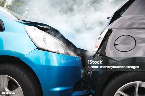 Close Up Of Two Cars Damaged In Road Traffic Accident Stock Photo - Download Image Now