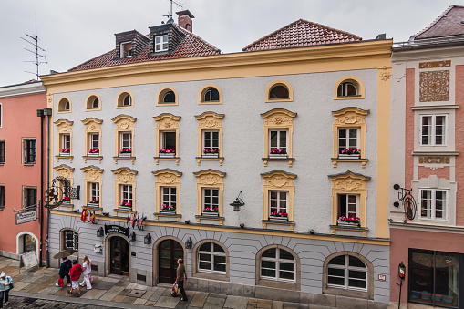 One of the small quiet streets in the historical center of Passau and Passauer Wolf Hotel. Passau, Germany, August 2010.