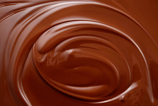 istock Chocolate background. Melted chocolate. Chocolate swirl. 1156655439