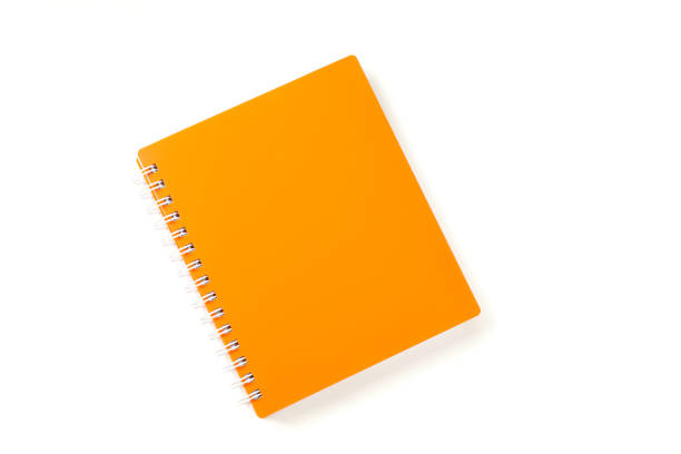 istock Orange notebook with space for text isolated on white background, top view 1156656344