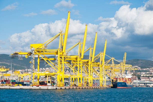 View to the cargo port of Trieste (Italy). Trieste, Italy - Nov. 02, 2012: View to the cargo port of Trieste. This port is an international seaport and a major container port for the Adriatic Region. (in the background Container Ship, MSC Malaga) trieste stock pictures, royalty-free photos & images