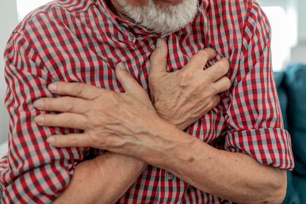istock Senior man suffering from heart attack at home 1156656743