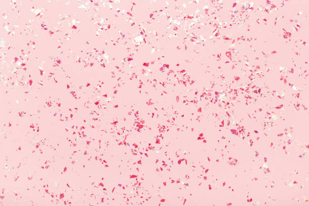 istock Red glitter mica sparkles on pink pastel trendy abstract background. 1156657136