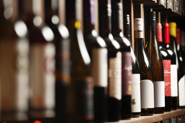 istock Wine cellar with elite drinks on shelves with written names 1156658882