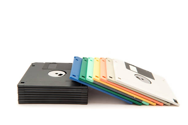 istock Stack of colorful floppy diskettes isolated on the white background. 1156660095