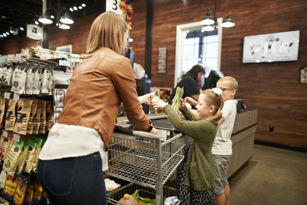 istock Mom's little shopper's assistants 1156660101