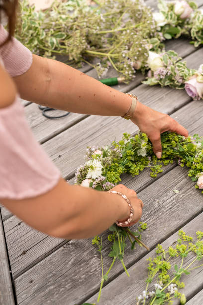istock Woman making a flower crown on midsummer in Sweden 1156660281