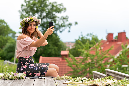 Woman Wearing A Homemade Flower Crown On Midsummer In Sweden Stock