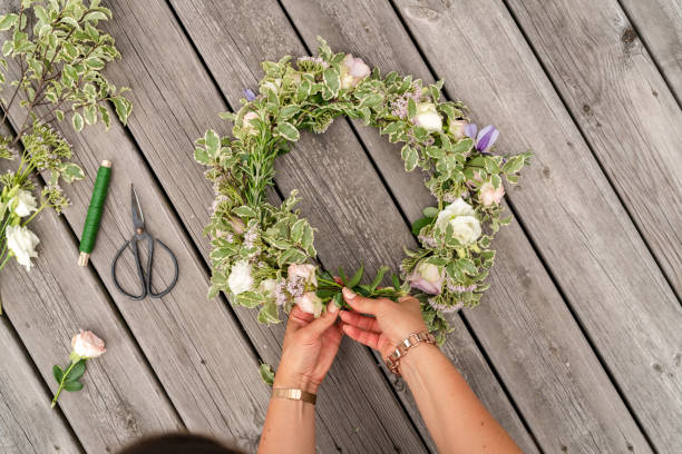 istock Woman making a flower crown on midsummer in Sweden 1156660358