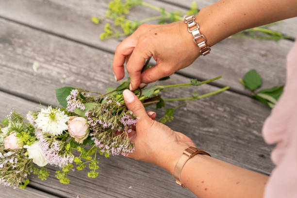 istock Woman making a flower crown on midsummer in Sweden 1156660365