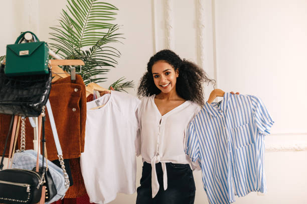 istock Young stylist choose clothes at rack in studio 1156660563