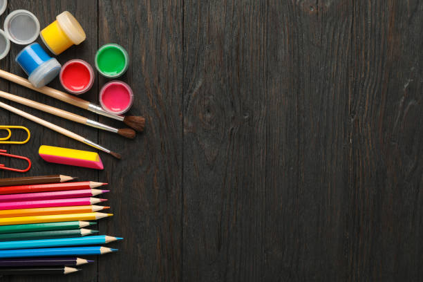 istock Flat lay composition with school supplies on wooden background, space for text 1156662106