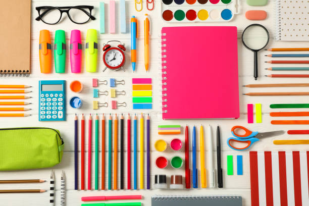 istock Flat lay composition with school supplies on white wooden background 1156662537