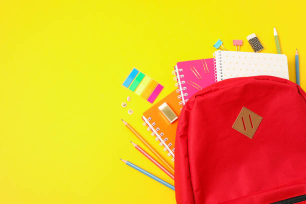 istock Flat lay composition with backpack and school supplies on color background 1156662638