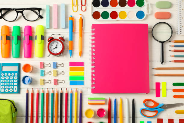 istock Flat lay composition with school supplies on white wooden background 1156663402