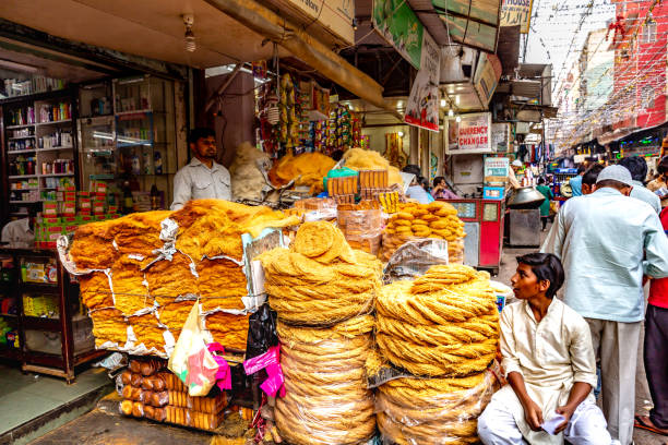 Busy streets with shops in Old Delhi,India This pic shows  busy and  and crowded street in old delhi. People selling different products on streets.  The  pic is taken in may 2019. old delhi stock pictures, royalty-free photos & images