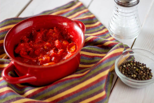 istock Chopped tomatoes on a white background. Top view. 1156666320