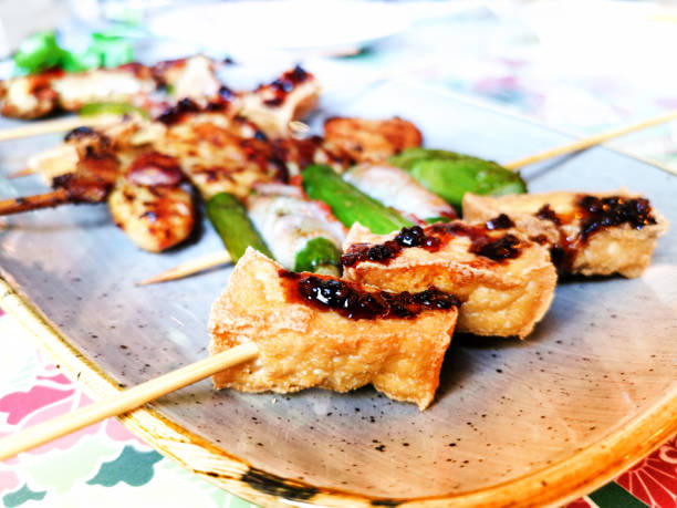 istock Six asian mixed satay made with tofu, curry chicken, asparagus and bacon 1156666775