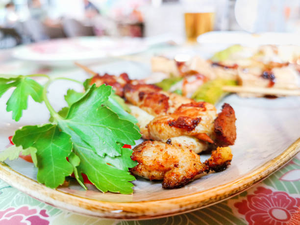 Six asian mixed satay made with tofu, curry chicken, asparagus and bacon