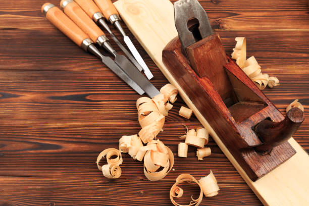 istock chisels plane and sawdust on a wooden table - Image 1156669074