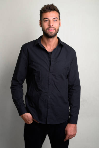 istock Studio shot of young handsome bearded businessman 1156669532