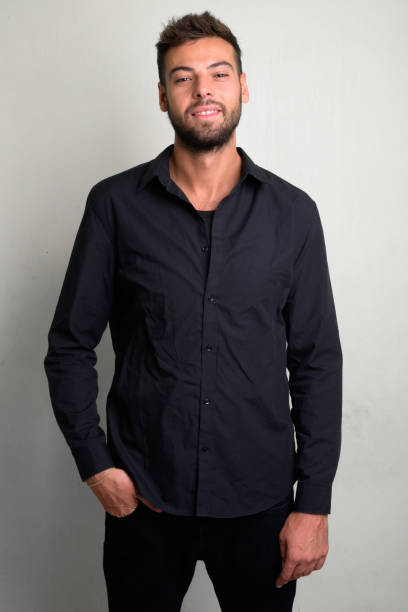 istock Studio shot of young handsome bearded businessman 1156669536