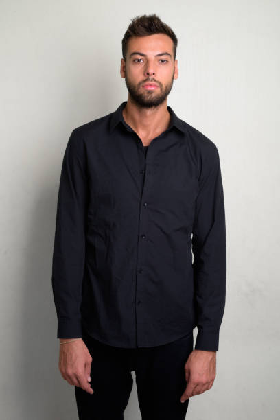 istock Studio shot of young handsome bearded businessman 1156669573