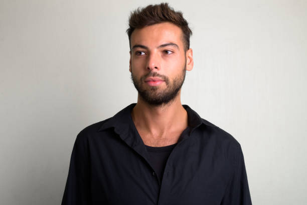istock Studio shot of young handsome bearded businessman 1156670987