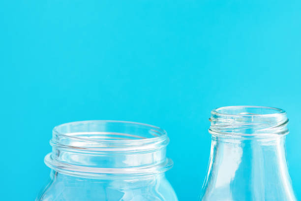 istock Glassware crystal bottle jar on light blue background. Reusable materials plastic-free alternatives zero waste environmental protection nature friendly living concept. Mock up poster with copy space 1156671076