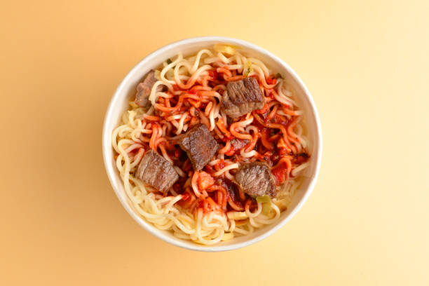 istock Paper cup with instant ramen noodles with beef and vegetables. 1156671302