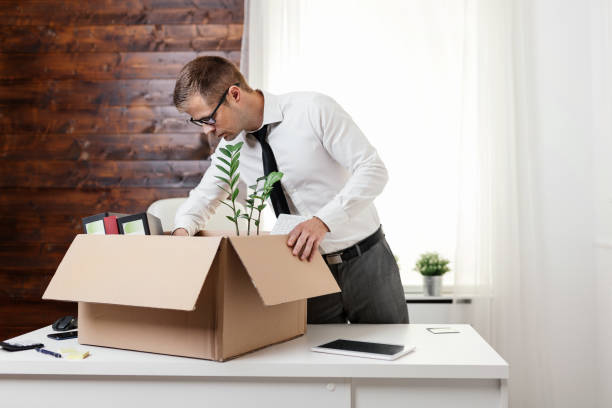 istock Businessman moving into a new office 1156676383