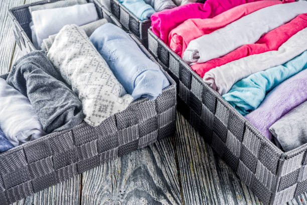 istock Vertical Marie Kondo tidying clothes method 1156676590