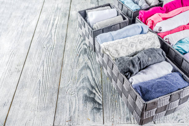 istock Vertical Marie Kondo tidying clothes method 1156676591