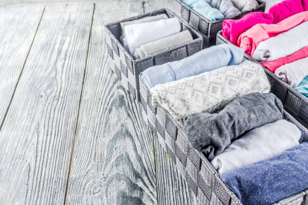 istock Vertical Marie Kondo tidying clothes method 1156676609