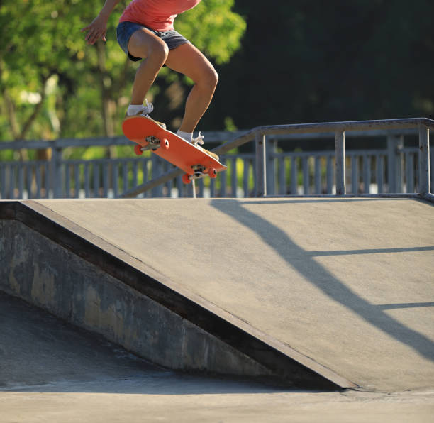 istock Skateboarder skateboarding on skate park 1156680046